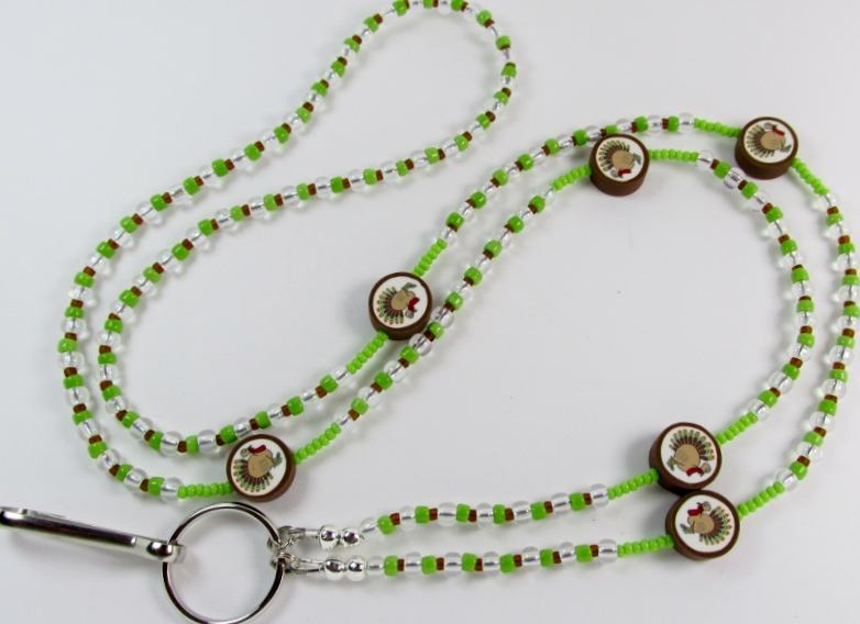 Green, Clear 
and Brown beaded lanyard with fimo turkey beads