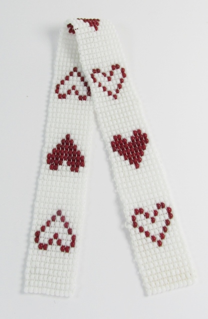 White and red glass beaded 
bookmark with red and white hearts design