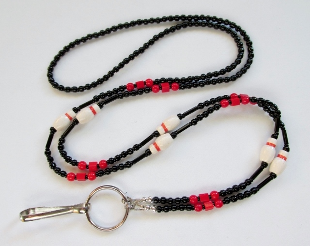 Black and Red 
Beaded Necklace with Ceramic Bowling Pin Beads
