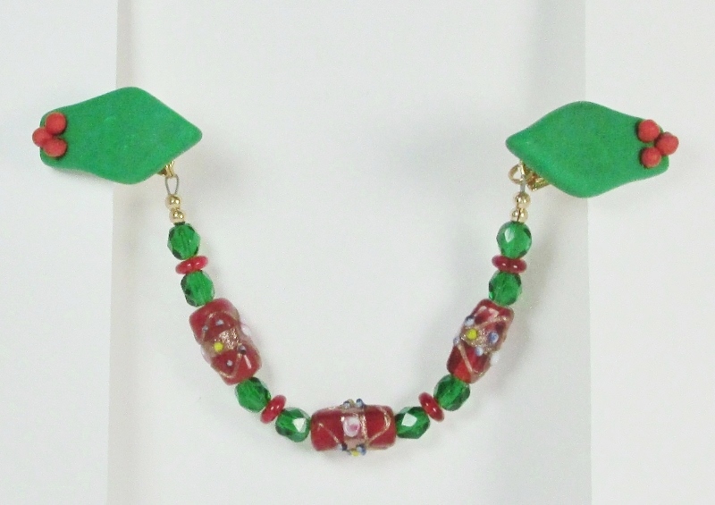 Red 
and green beaded Christmas sweater guard clip