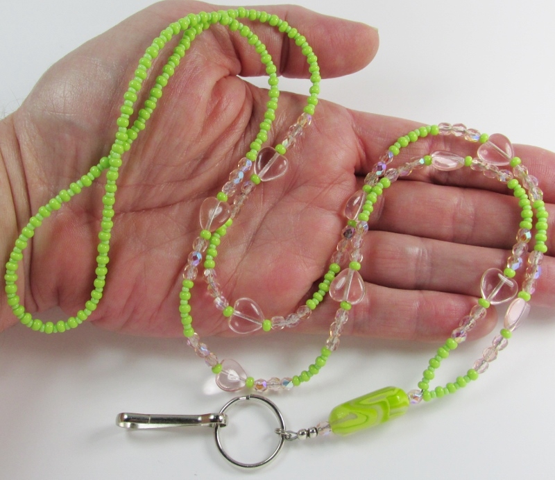 Green and 
pink glass beaded lanyard with pink glass hearts