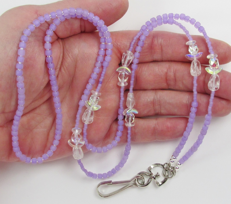 Purple and 
clear glass beaded lanyard with rainbow clear glass angels